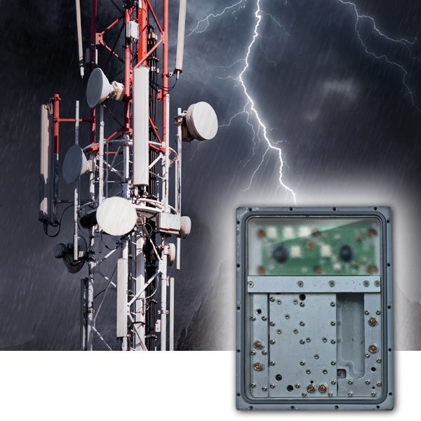 view of open device using Gore protective vents, with radio frequency tower in background with lightning
