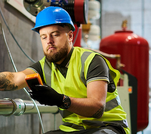 male worker reading mobile device