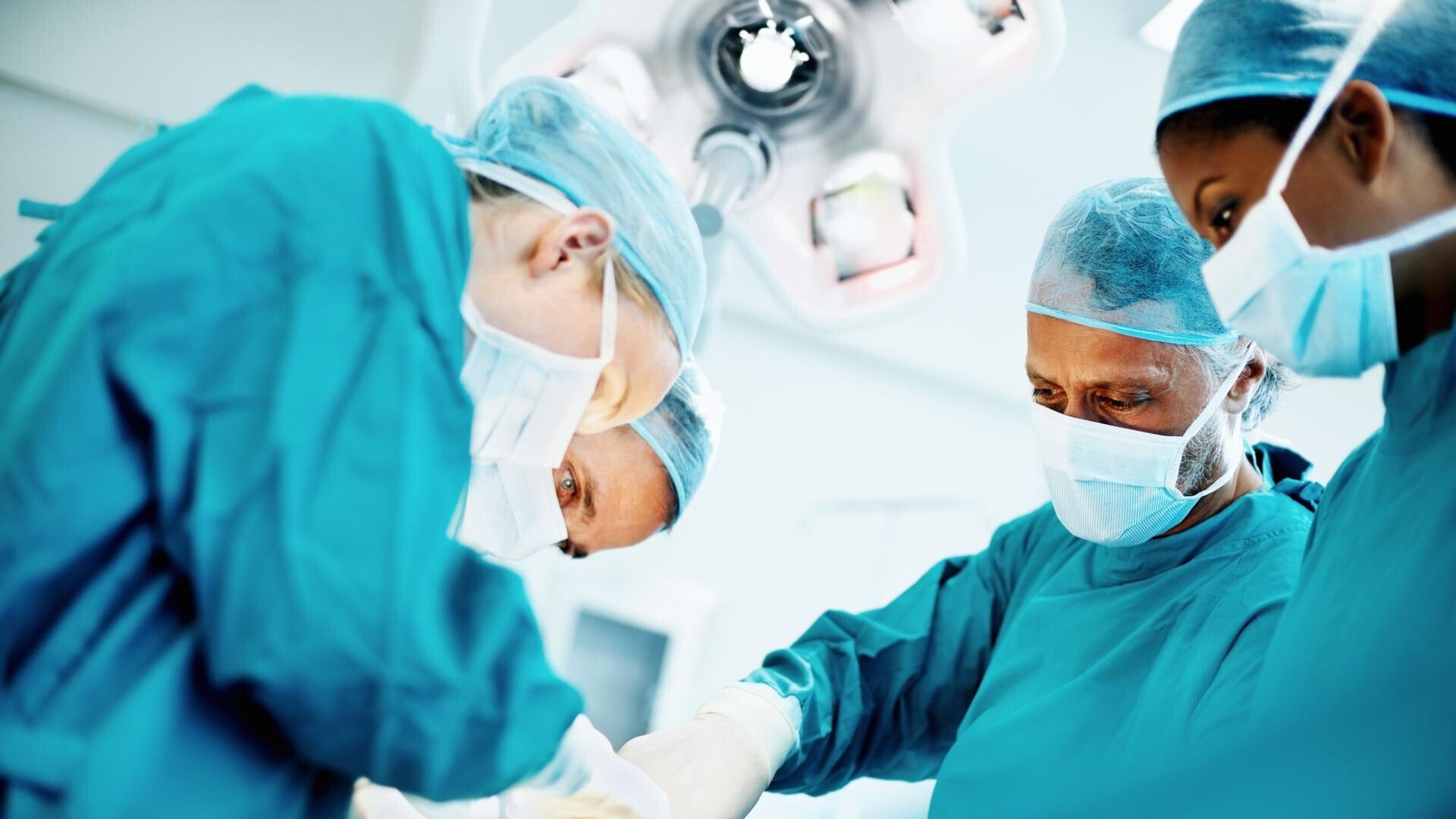doctors working on a patient in an operating room