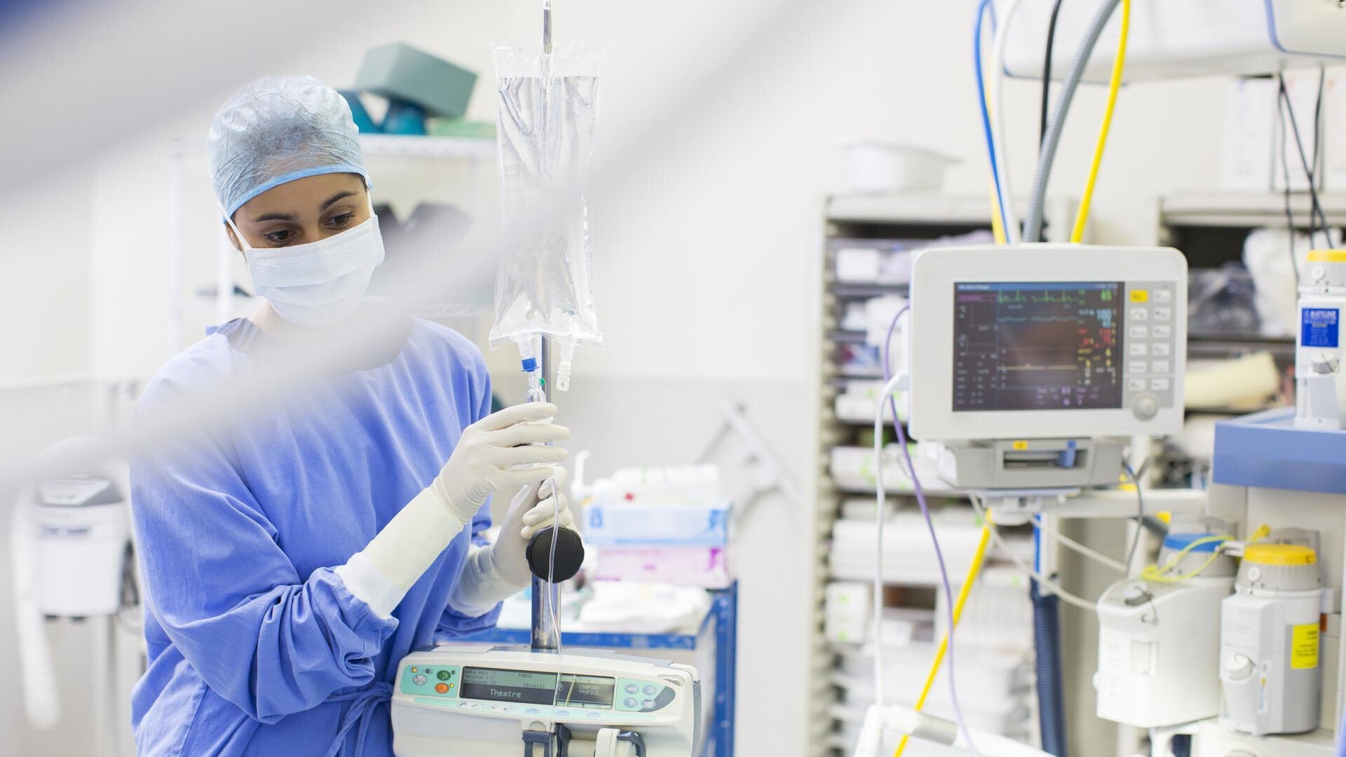 medical professional in a hospital with a variety of equipment