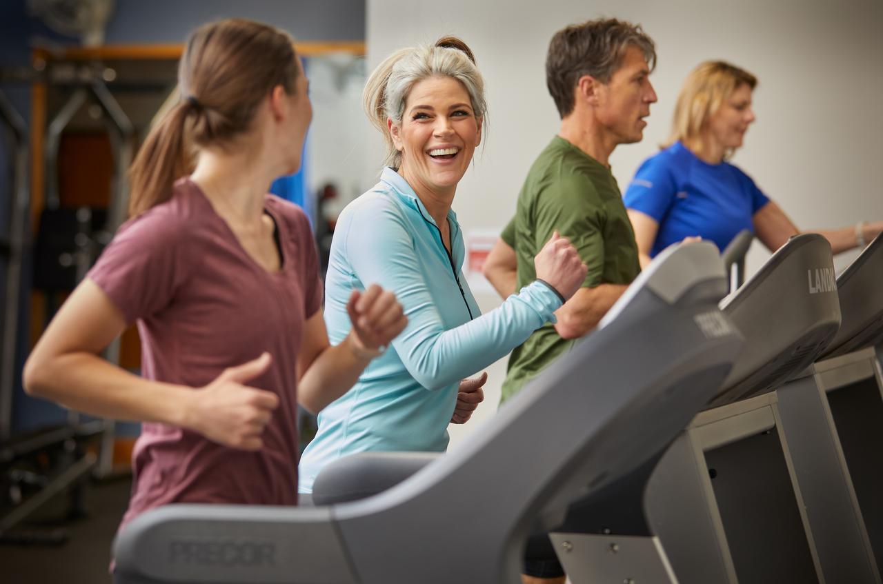 associate exercising in a plant gym