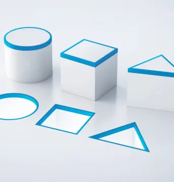 Stylistic blocks shaped as a circle, blue and triangle. A hole is found on the ground with the exact shapes indicating an exact fit.